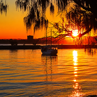 6616ab8ed8c3c268632d0a1d_golden-harbour-sunset_1791283686189.png