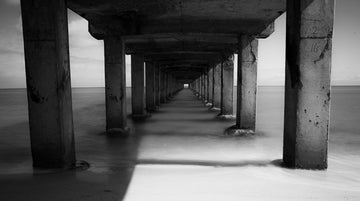 A long exposure photography of a monotone pier - 1