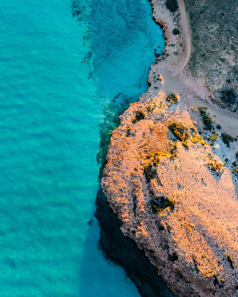 6616ab8ed8c3c268632d0a1d_coral-bay-coastline-_1776398021225.jpg