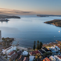 6616ab8ed8c3c268632d0a1d_fairlight-beach-from-above_1757989200676.jpg