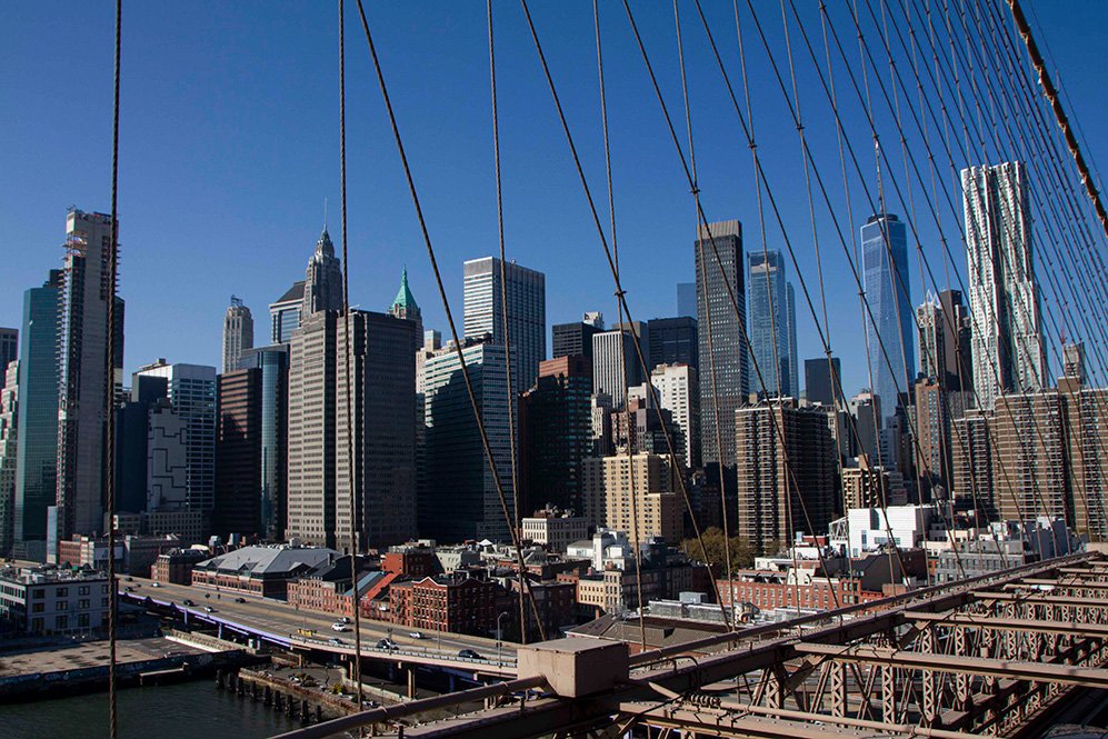 6616ab8ed8c3c268632d0a1d_klein-brooklyn-bridge-cables-framing-manhattan-skyline_1764152043404.jpg