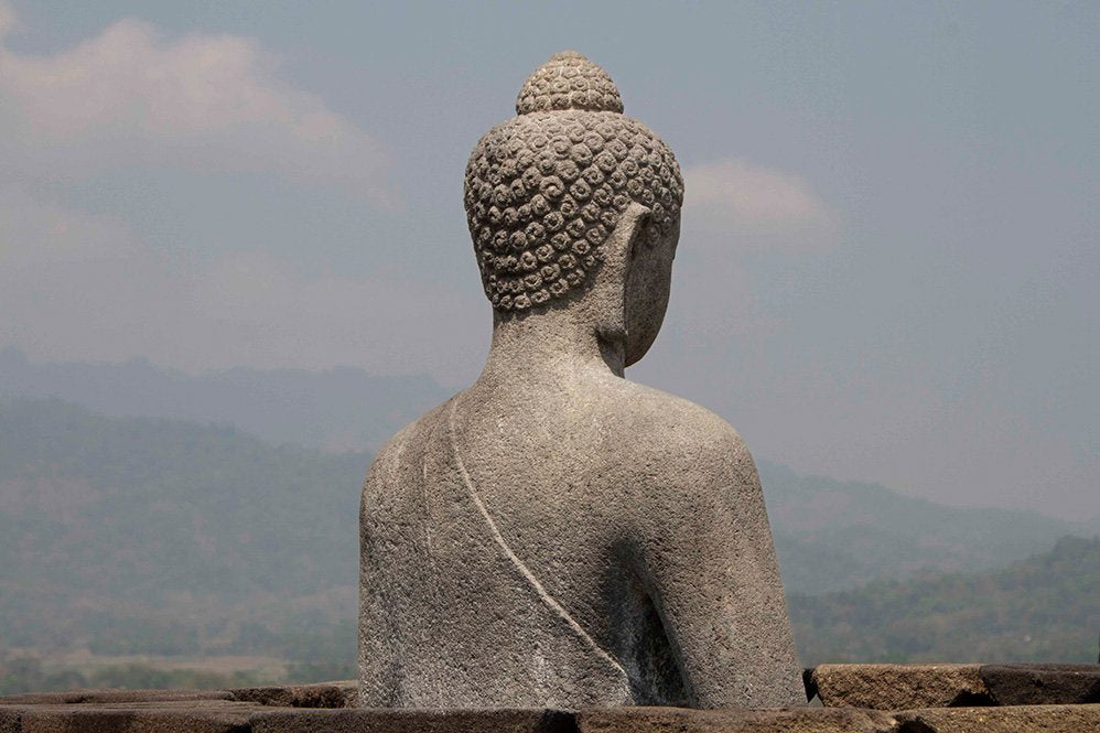 6616ab8ed8c3c268632d0a1d_klein-buddha-statue-overlooking-misty-hills_1764584386680.jpg