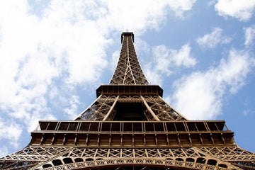 6616ab8ed8c3c268632d0a1d_klein-eiffel-tower-reaching-into-cloudy-sky_1764585506503.jpg