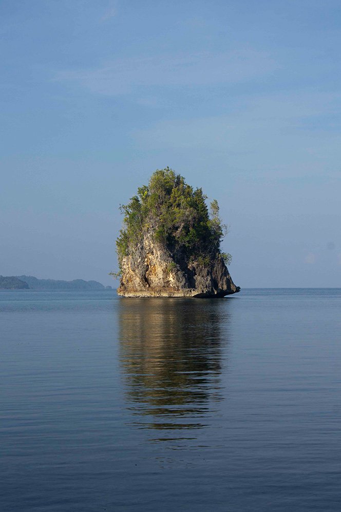 6616ab8ed8c3c268632d0a1d_klein-solitary-limestone-island-on-calm-sea_1764151266852.jpg