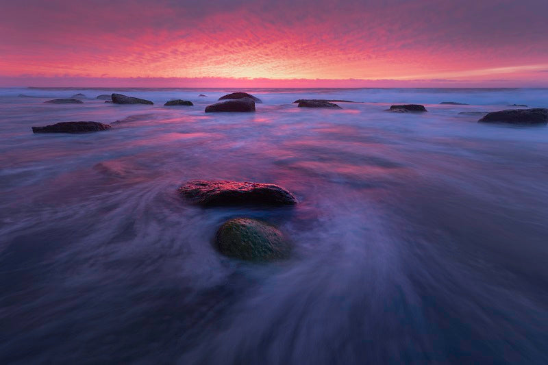 Red sunrise over Turimetta beach
