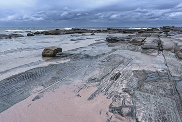 Rock and sand at Blue Bay