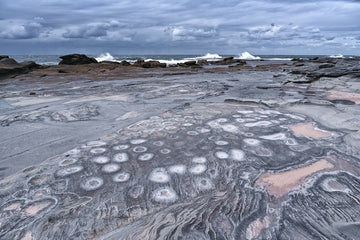 Rock and wave at Blue Bay