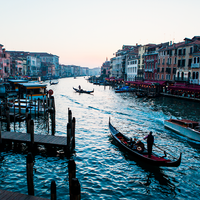 Sunset in Venice featuring a strem of boats and gondola