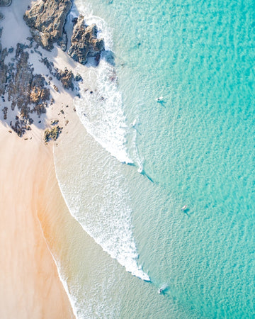 Surfers in the Blue