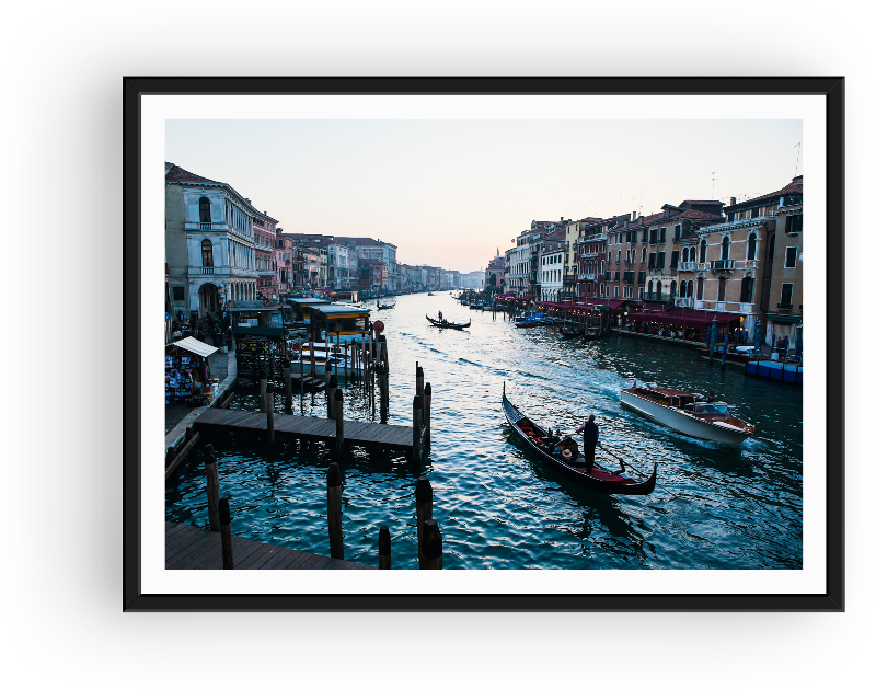 Sunset in Venice featuring a strem of boats and gondola