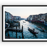 Sunset in Venice featuring a strem of boats and gondola