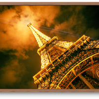 Eiffel Tower with it's beaming lights at night in Paris