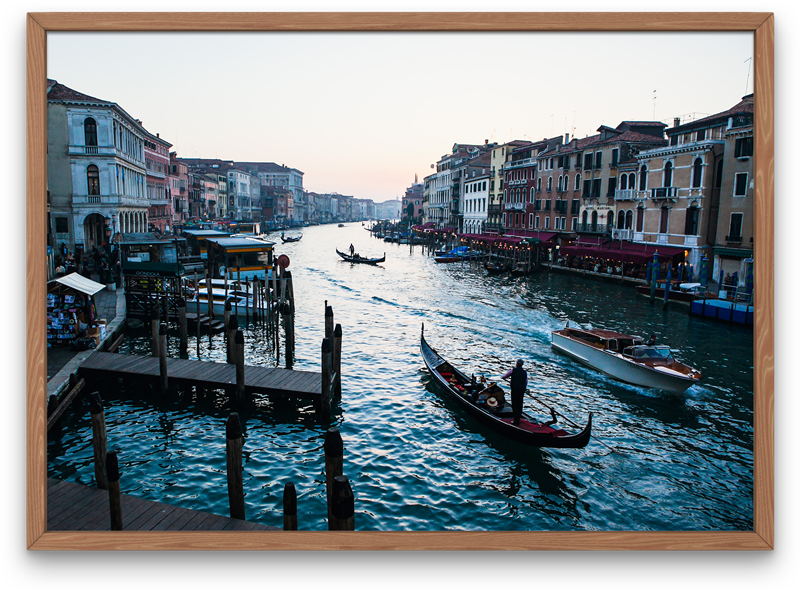 Sunset in Venice featuring a strem of boats and gondola