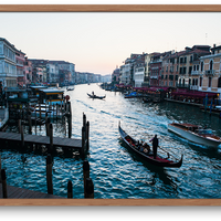 Sunset in Venice featuring a strem of boats and gondola