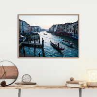 Sunset in Venice featuring a strem of boats and gondola