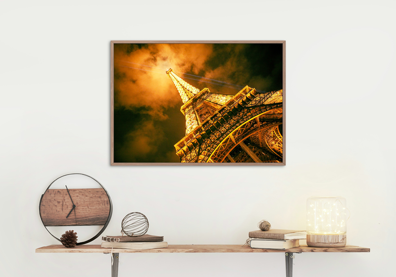 Eiffel Tower with it's beaming lights at night in Paris