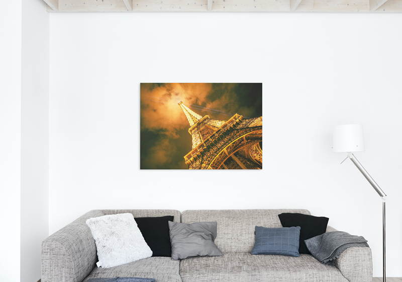 Eiffel Tower with it's beaming lights at night in Paris